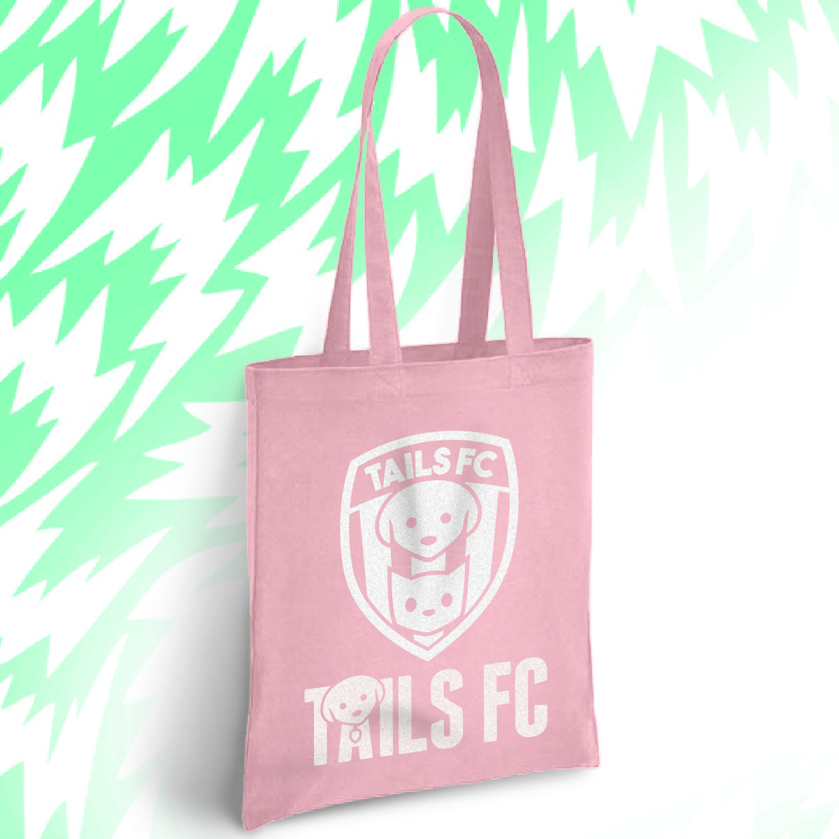 Pink tote bag with 'TAILS FC' logo on a light green abstract background