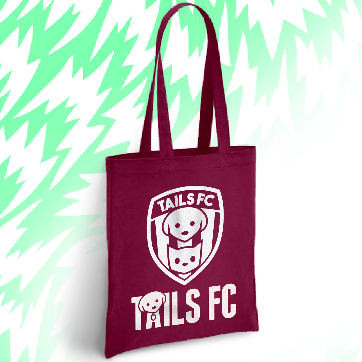 Maroon tote bag with 'TAILS FC' logo on a light green background.